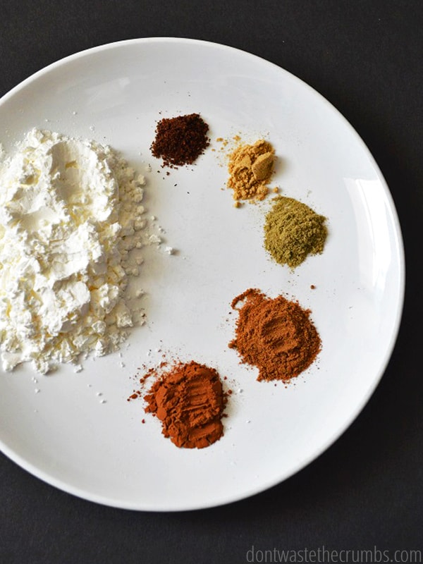 Dry spices on a white plate.