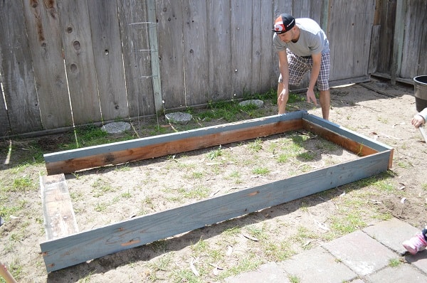 Wondering how to plant a garden without spending a fortune? Here's a picture tutorial showing how to build a raised garden bed for less than $15! :: DontWastetheCrumbs.com