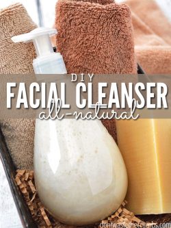 Pump bottle with homemade face wash in a caddy with towels. Text overlay says, "DIY Facial Cleanser: All Natural".