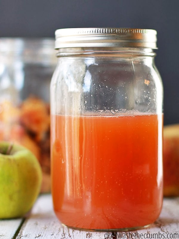 Homemade apple cider vinegar in a mason glass jar.