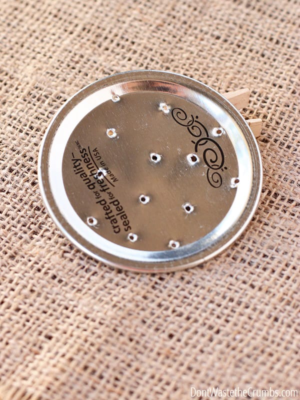 Small holes on a mason jar lid.