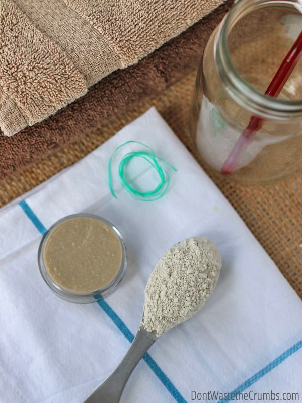 Bentonite clay is an excellent detoxifier. A spoon of clay sits beside a small bowl of homemade toothpaste. 