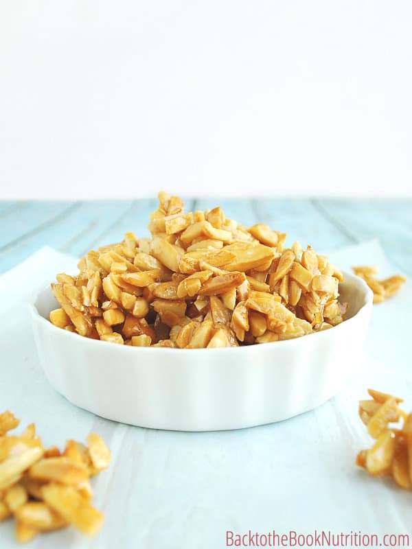 Homemade honey roasted almonds are THE BEST topping for any salad, hands down. Plus you save over 70% by making them yourself! 3 simple ingredients and ready in less than hour, stop wasting your money on expensive store-bought nuts and go the healthier, more affordable route by doing them yourself! :: DontWastetheCrumbs.com