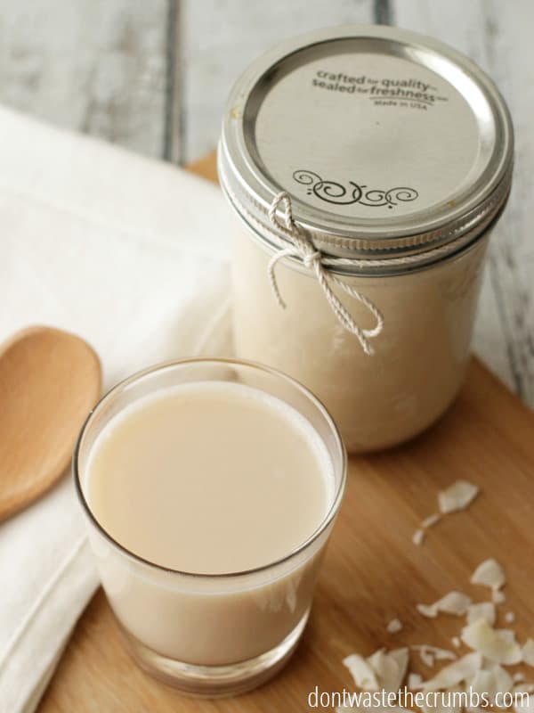 Get this - you can save 85% on coconut milk by making it yourself! 2 simple ingredients and 2 minutes is all it takes to make this homemade coconut milk recipe, and without all the added junk, it's so much healthier than store bought! :: DontWastetheCrumbs.com