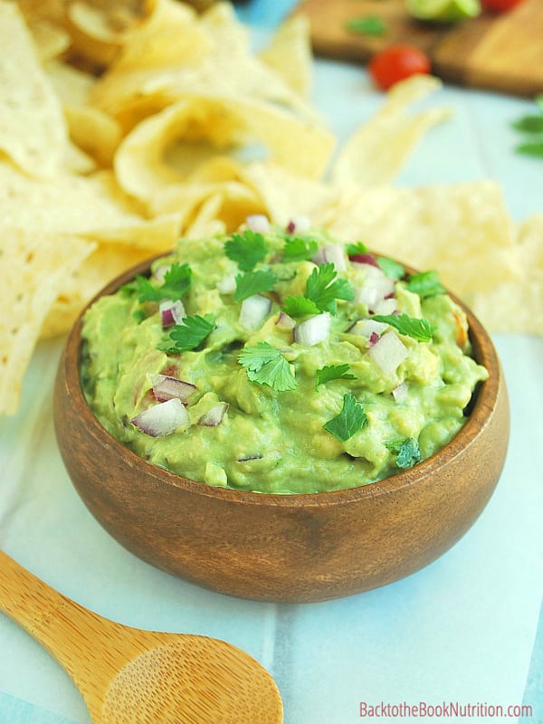 Kid-approved, this is our family's favorite homemade guacamole recipe and it beats every restaurant in town - hands down!! Plus the secret to keeping guacamole green - you'll be shocked at the simple secret! :: DontWastetheCrumbs.com