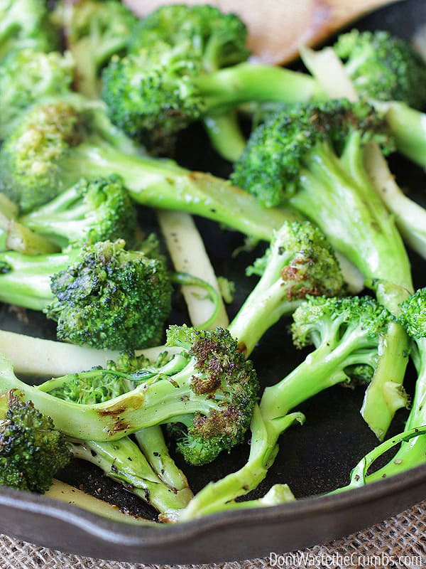 Freshly seasoned broccoli being cooked in a cast iron skillet. It comes out pan seared to perfection!