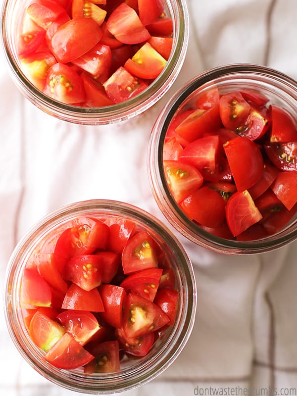 Diced tomatoes in three canning jars