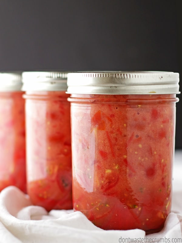 Canned diced tomatoes in three canning jars