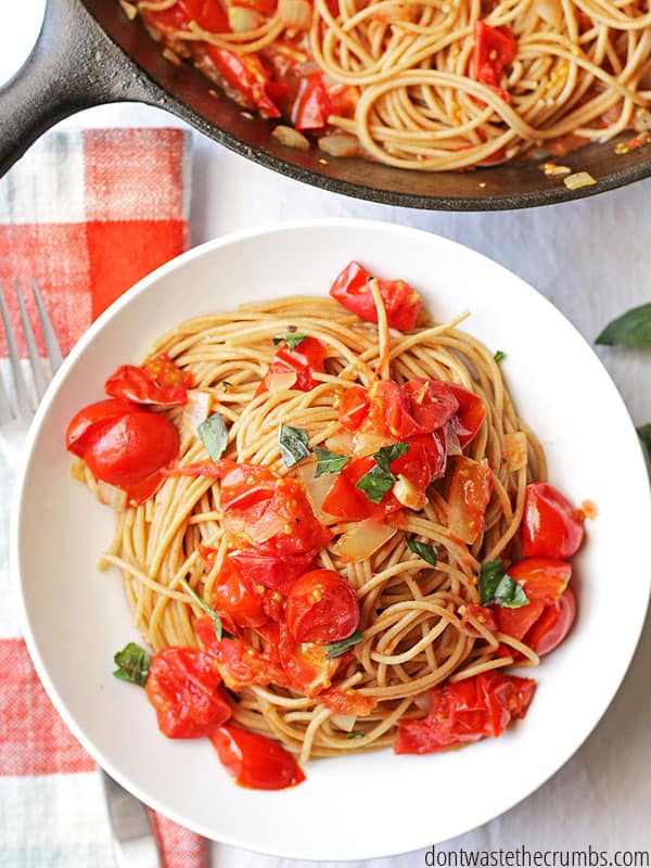 Homemade spaghetti sauce from fresh tomatoes on a white plate.