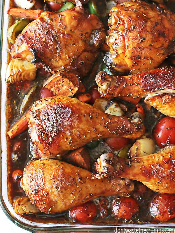 Six sticky and robust pieces of chicken a top a bed of roasted vegetables. 