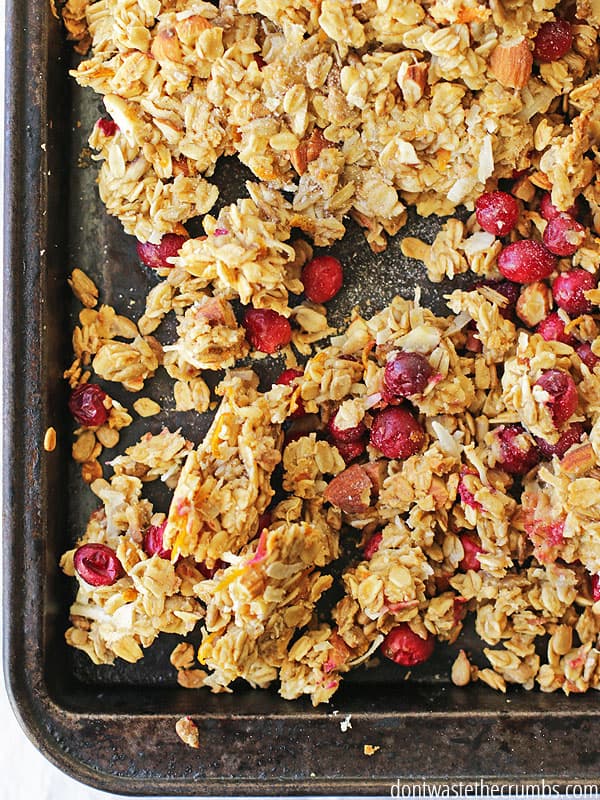 This cranberry orange granola is so good! It tastes like Christmas and is so much healthier for you than a bowl of processed cereal. One batch makes over 8 servings for about 63¢ each. Plus you can make it ahead of time for the whole week or even offer as an easy homemade gift for Christmas too! :: DontWastetheCrumbs.com
