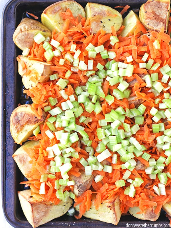 Buffalo chicken potato nachos on a baking sheet pan.