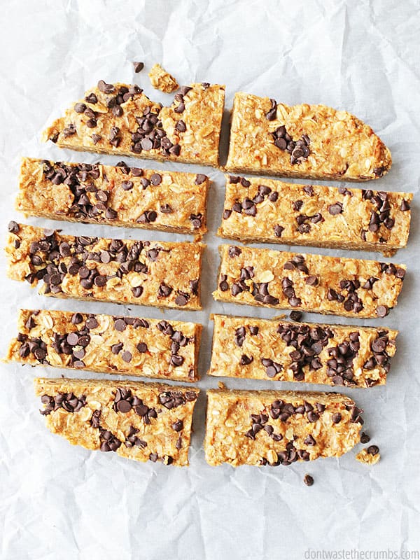 These peanut butter granola bars are cut in rectangles and ready to be eaten! There are chocolate chips in the bars.