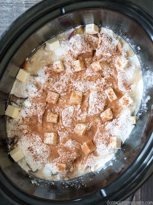 It's too hot to use the oven in the summer, but you can still make a great dessert. Slow cooker peach cobbler is a tribute to the peach cobbler dump cake, except this version is made with real food and no boxes! :: DontWastetheCrumbs.com