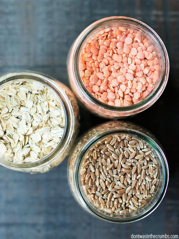 Three mason jars with different grains.