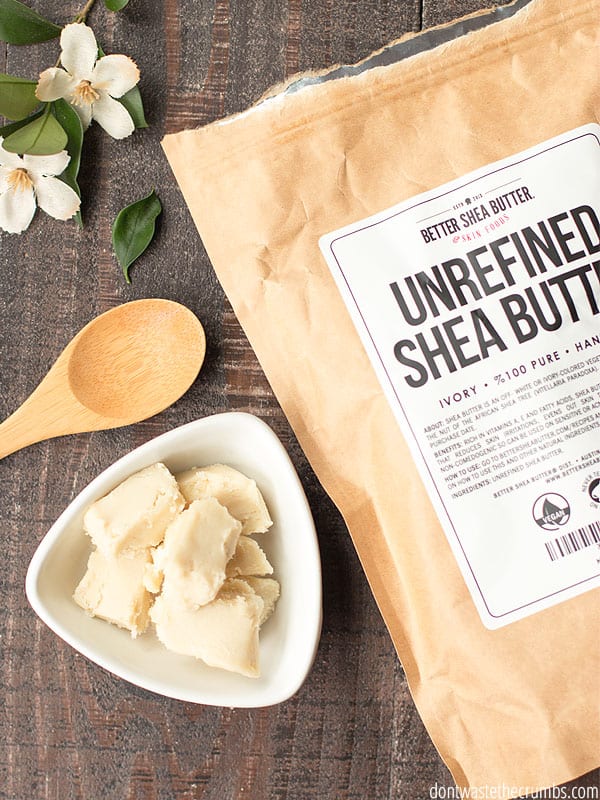 Unrefined Shea Butter is cut into rectangular cubes and displayed in a bowl next to a bag from "Better Shea Butter Skin Foods."