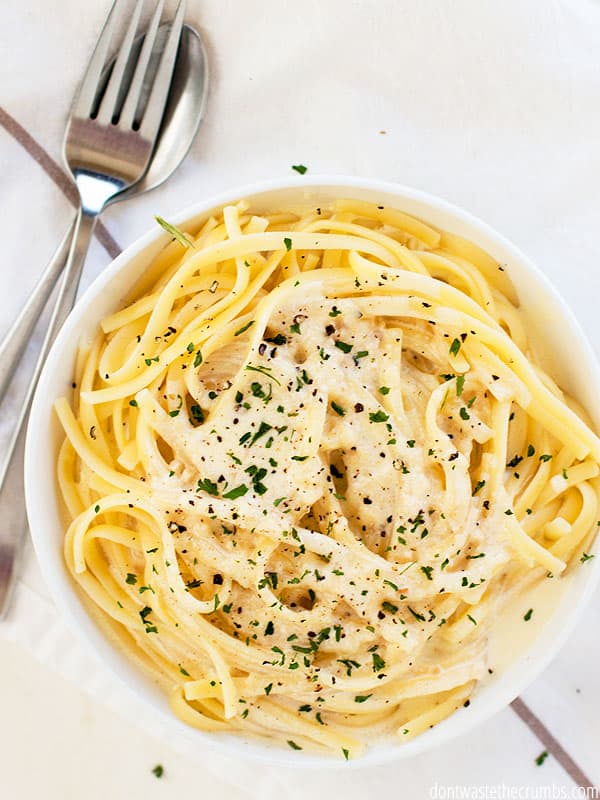 The best homemade alfredo sauce recipe is served warm over fettuccini pasta and finished with a sprinkle of fresh parsley. 