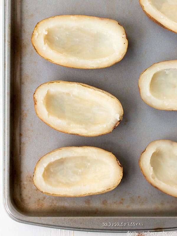 Potato skins on a baking sheet.