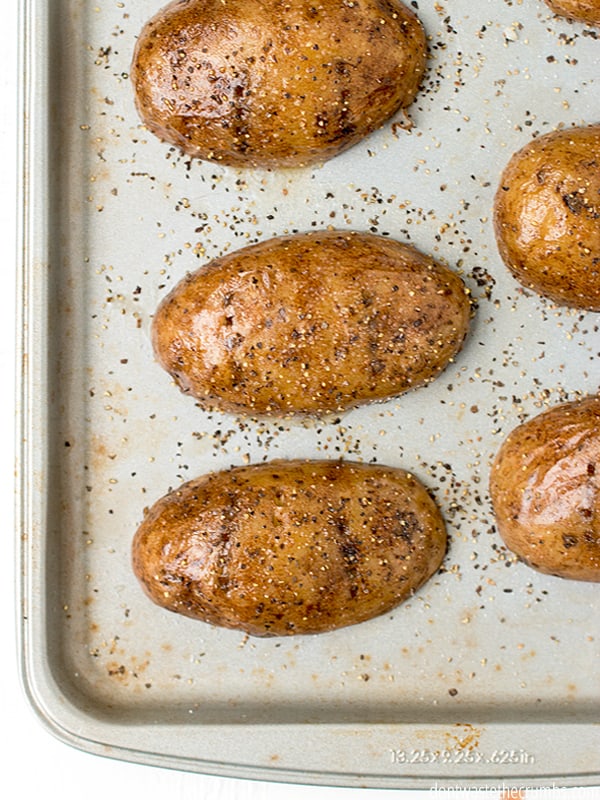 Potato skins on a baking sheet.