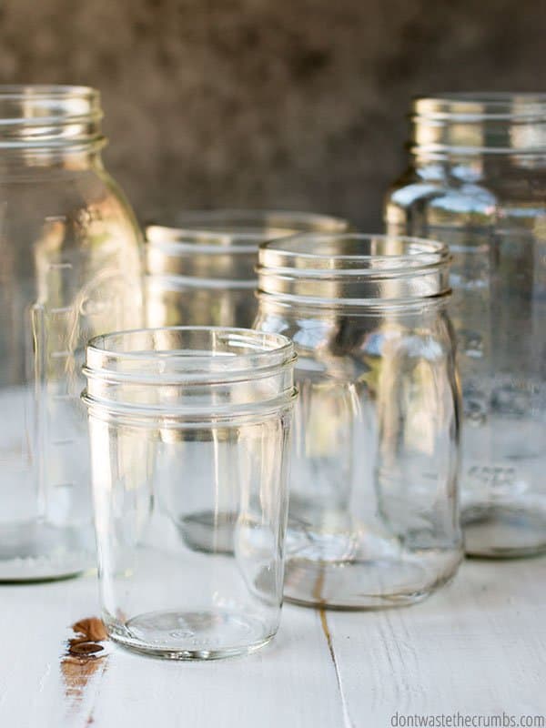 Five mason jars, ranging in size from pint to quart, show a variety of jar styles, including straight edged, shouldered, and wide mouth.