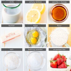 Image containing recipe ingredients milk, whole lemon, vanilla + honey, butter, eggs, flour, salt, baking powder, and strawberries. 