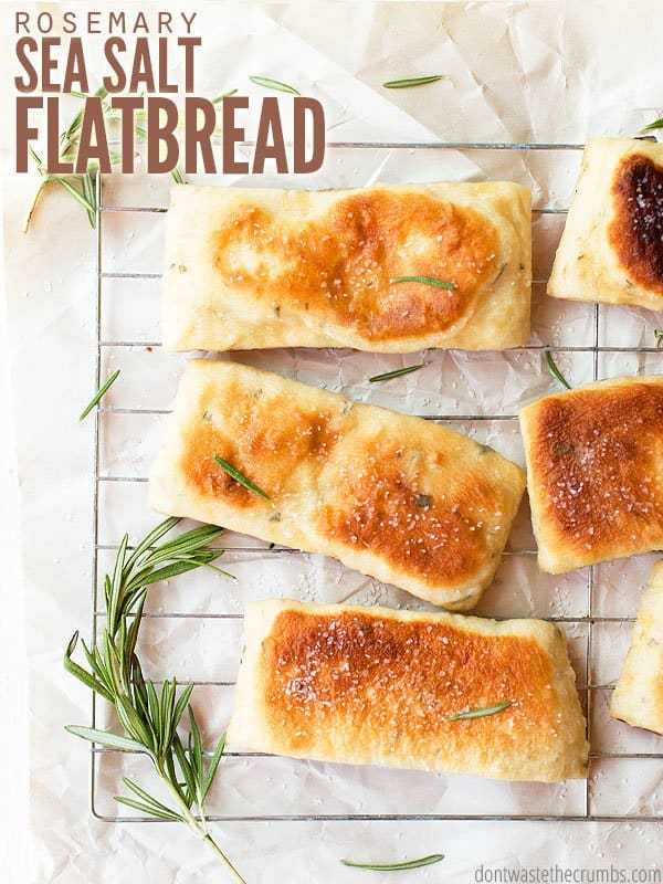 Rosemary sea salt flatbread with olive oil is so soft and chewy - hard to believe it starts with pizza dough! Or roll thin dough for crispy crackers! :: DontWastetheCrumbs.com