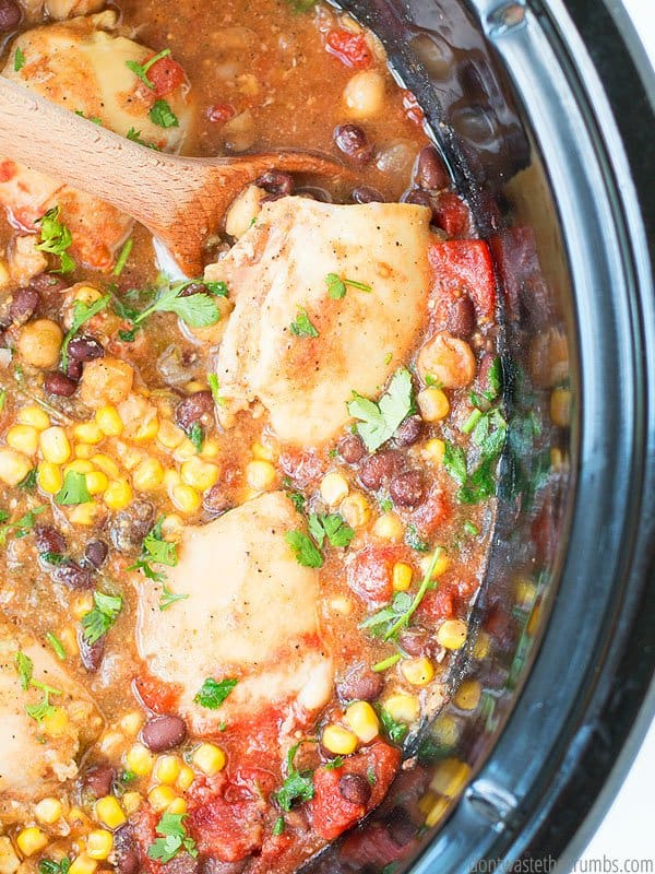 Slow cooker salsa chicken is in a crock pot.