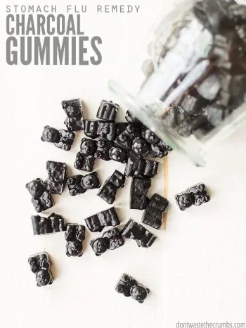Jar tipped over with gummy bears falling out. Text overlay says, "Stomach Flu Remedy Charcoal Gummies".
