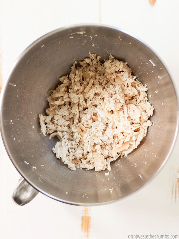 Shredded chicken in a KitchenAid mixer.