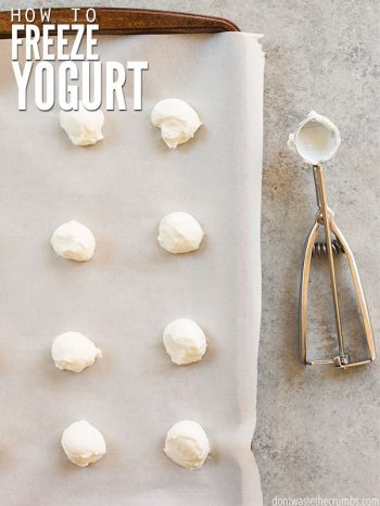 Stone cookie sheet, covered with white parchment paper with eight scoops of white yogurt. Text overlay How to Freeze Yogurt.