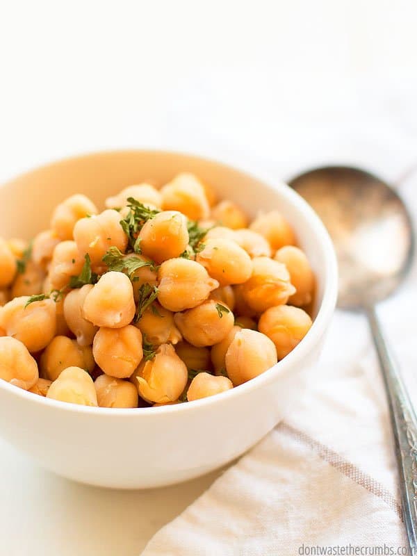 These garbanzo beans that are in a glass white bowl are made from the Instant Pot.