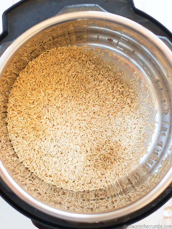 Brown rice grains are inside an Instant Pot.