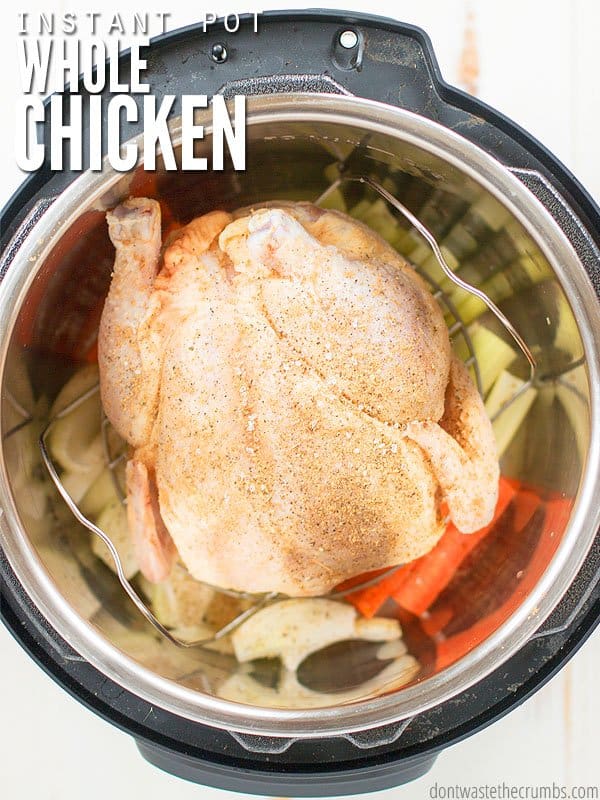 Overview of an Instant Pot, filled with a whole season chicken, with carrots celery and onions. Text overlay Instant Pot Whole Chicken.