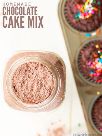 An overview of a large Mason jar filled with dry chocolate cake mix. A baking sheet filled with cooked cupcakes, topped with colorful sprinkles. Text overlay Homemade Chocolate Cake Mix.