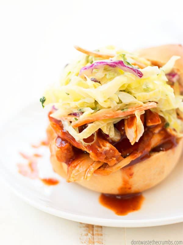 This barbecue chicken is served atop a homemade bun and layered with fresh coleslaw and an extra spoonful of barbecue sauce. 
