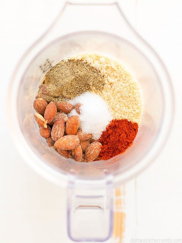 Ingredients for almond crusted chicken in a blender.