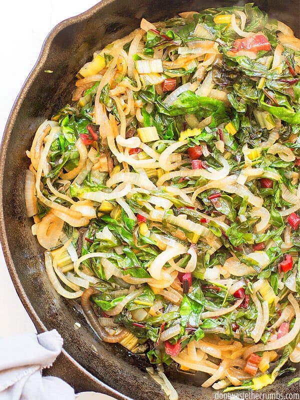 Caramelized Onions and Swiss Chard in a large cast iron skillet.