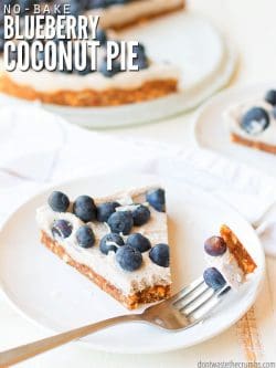 Round white serving dish with a slice of blueberry coconut pie. A fork stis with bite ready to eat. Text overlay No Bake Blueberry Coconut Pie.