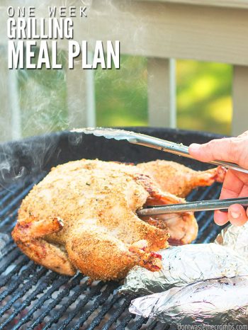 Whole seasoned chicken on round a BBQ grill with a silver set of tongs. Steam rises in the background with two potatoes wrapped in aluminum foil in the foreground. Text overlay One Week Grilling Meal Plan.