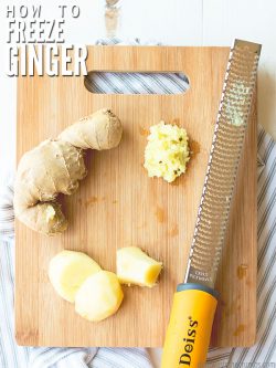 Wood cutting board with uncut Ginger root, sliced Ginger and minced ginger, with a silver zester. Text overlay How to Freeze Ginger.