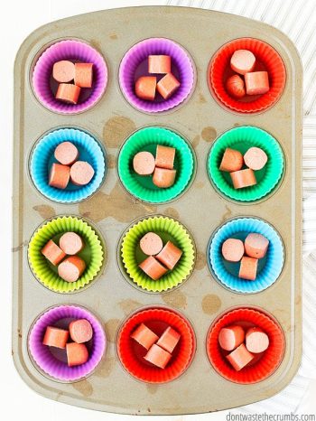 Cut up hot dogs in silicone muffin liners in a muffin tin.