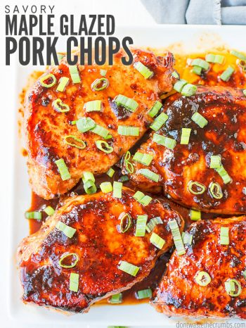 Plate of glazed pork chops topped with chopped green onions. Text overlay says, "Savory Maple Glazed Pork Chops".