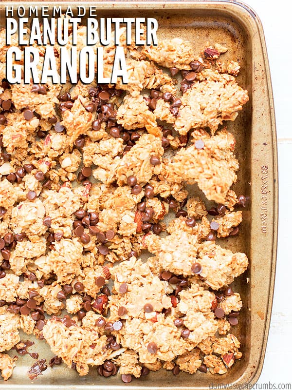 Stone cooking sheet pan filled with granola. Text overlay Homemade Peanut Butter Granola.