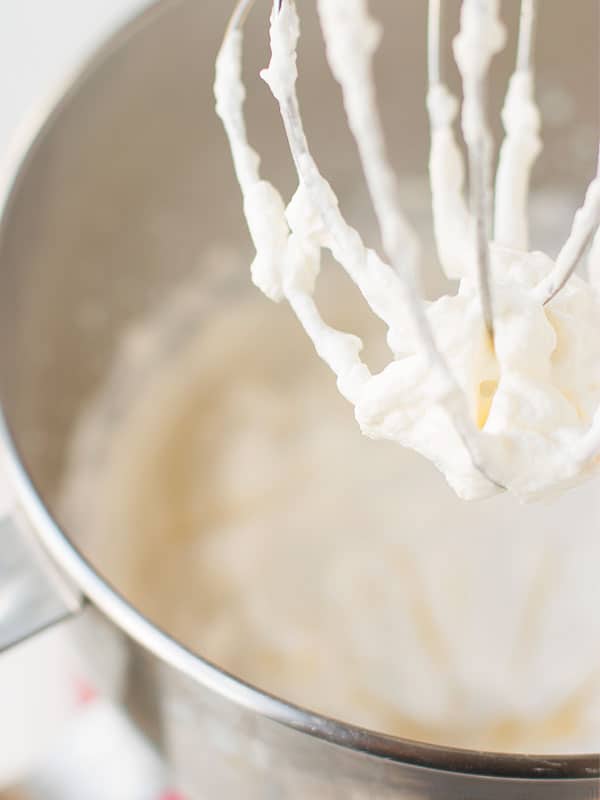 Light and flavorful whipped cream in a stand mixer with a whisk. This homemade whipped cream recipe is AMAZING for family gatherings and holidays!