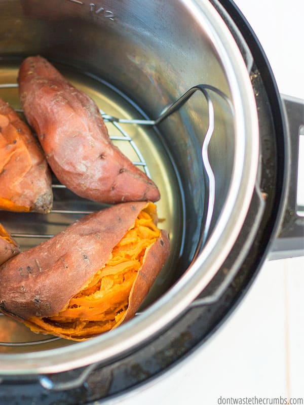 Well cooked sweet potatoes on a trivet inside an Instant Pot shown from a birds eye view.