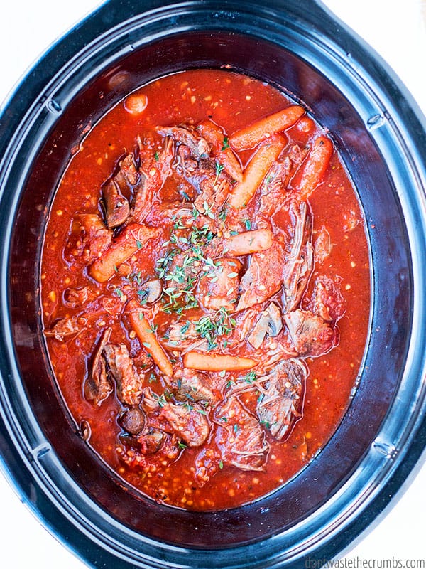 Crockpot filled with finished beef ragu.