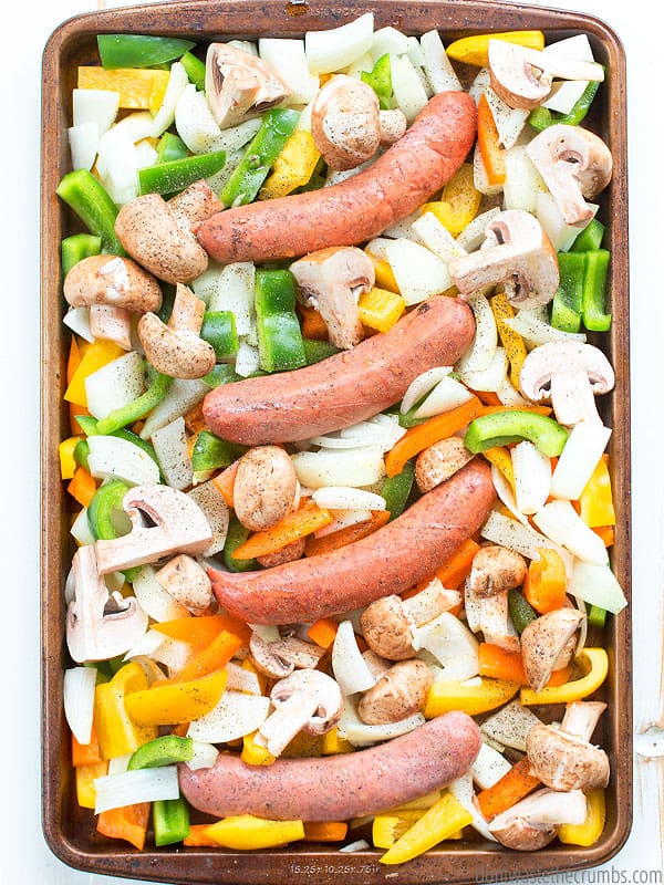 Sausage and pepper sheet pan dinner with onions and mushrooms. 