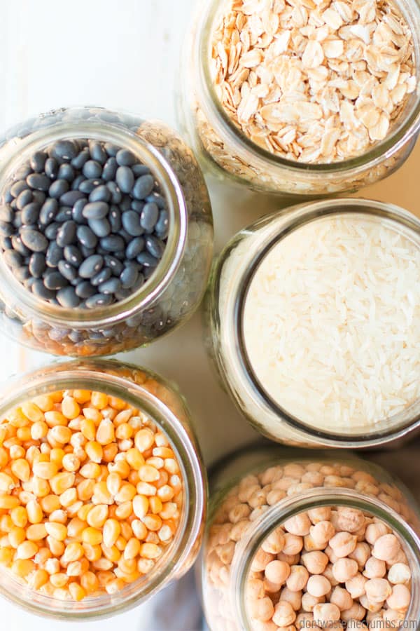 What is Batch cooking? Ways to save time and money with batch cooking. Jars of black beans, oatmeal, rice, corn, and garbanzo beans.