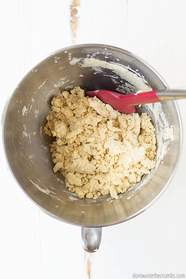Dough is moistened with added milk, still crumb-like in texture.