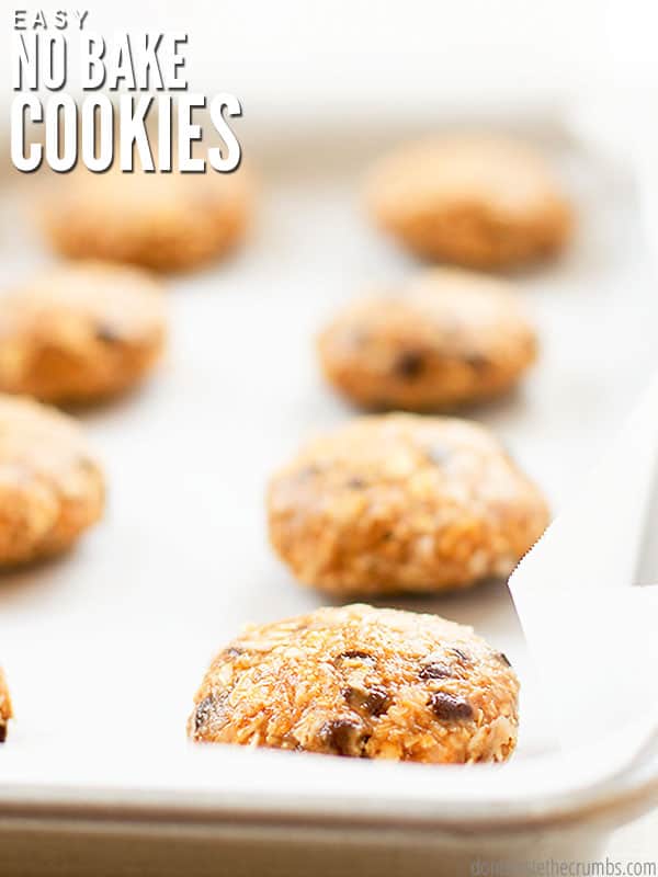 Batch of cookies on a parchment lined baking sheet. Text overlay reads Easy No Bake Cookies